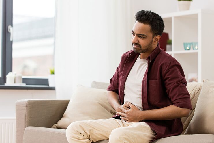 A man experiencing the first symptoms of prostatitis